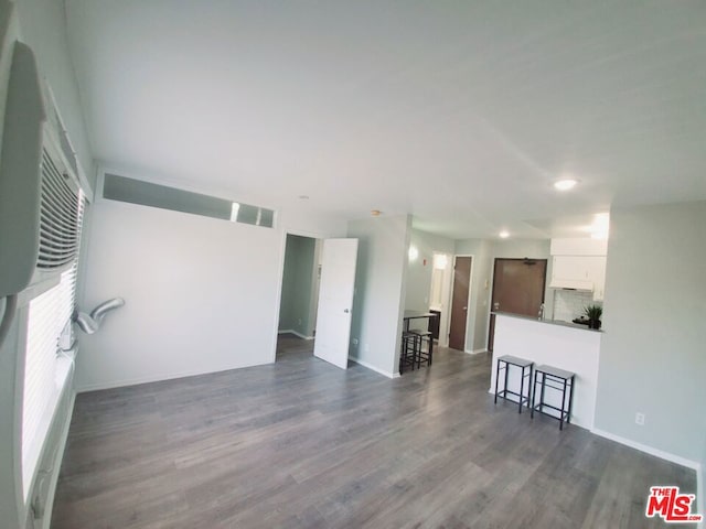 living room with dark hardwood / wood-style flooring