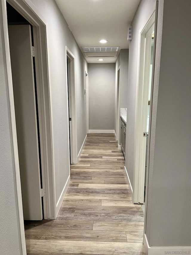 hallway featuring light hardwood / wood-style flooring