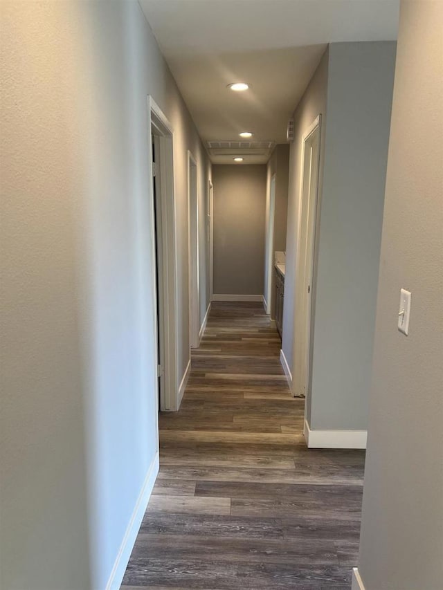 hallway featuring dark wood-type flooring