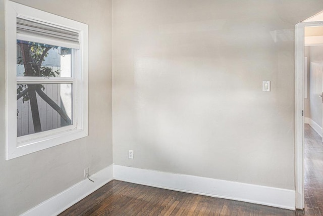 unfurnished room featuring dark hardwood / wood-style floors