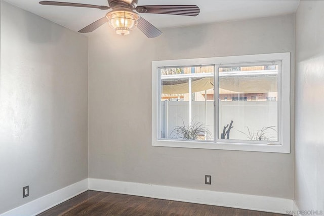 unfurnished room featuring ceiling fan and dark hardwood / wood-style floors