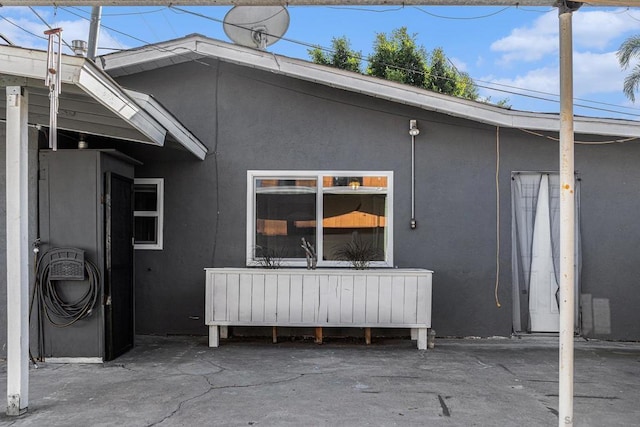 back of property featuring a patio