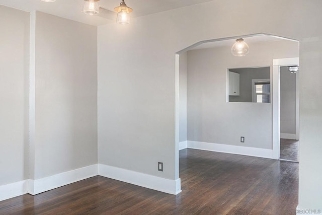 spare room featuring dark hardwood / wood-style floors