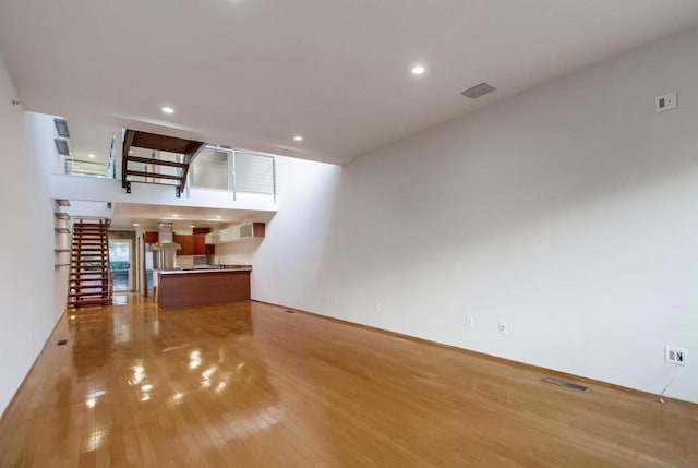 unfurnished living room with light wood-type flooring