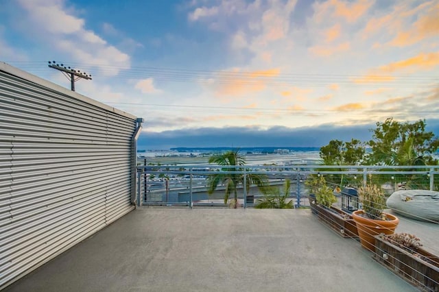 view of balcony at dusk