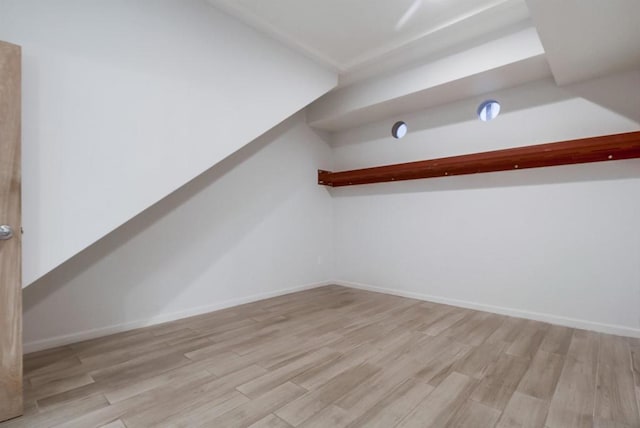 bonus room with light hardwood / wood-style floors