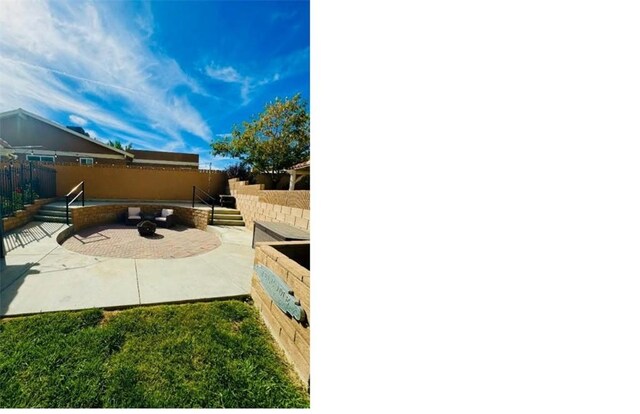 view of patio featuring a fire pit