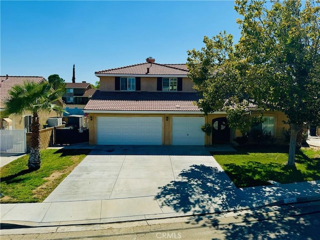 view of front of home featuring a front yard and a garage