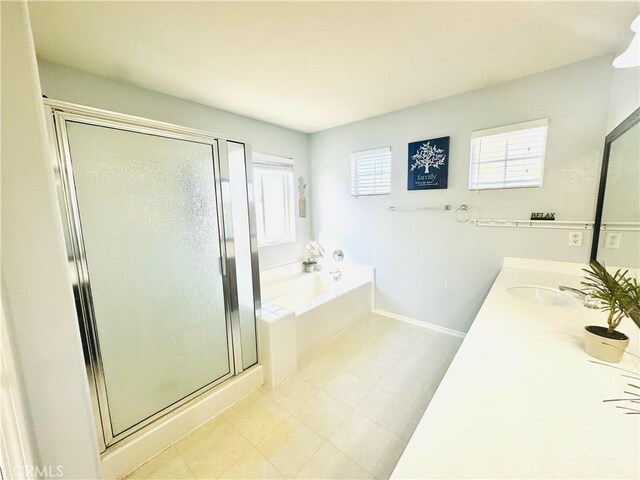 bathroom with vanity and independent shower and bath