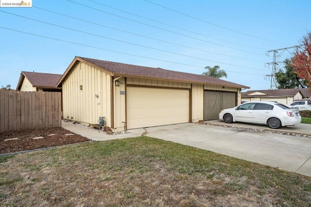 garage featuring a yard