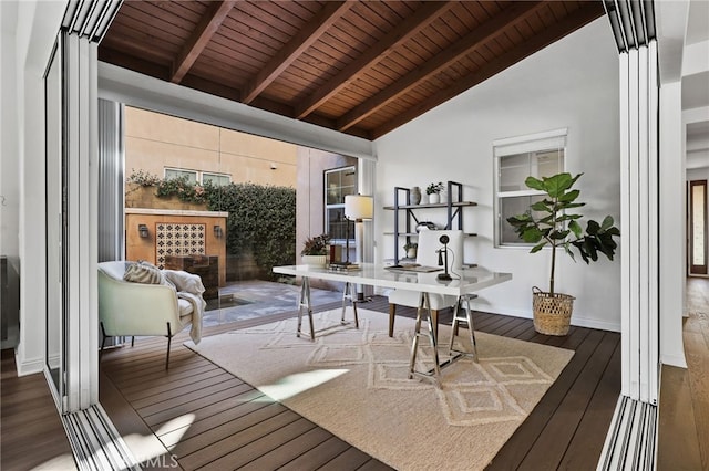 interior space featuring beam ceiling, dark hardwood / wood-style floors, high vaulted ceiling, and wooden ceiling