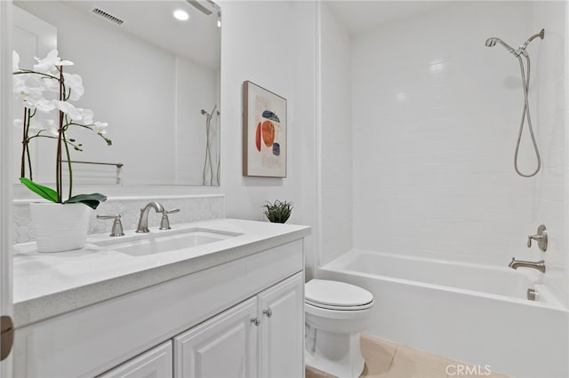 full bathroom with tile patterned flooring, vanity, toilet, and tiled shower / bath