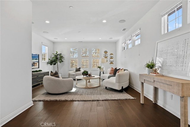 living room with dark hardwood / wood-style flooring