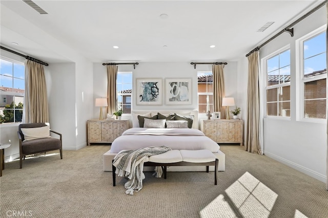 bedroom featuring light colored carpet