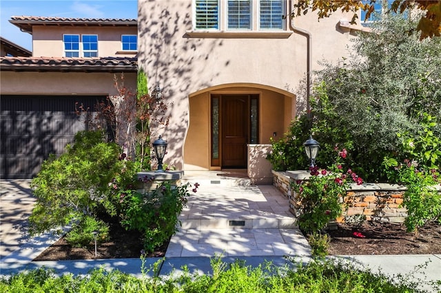 entrance to property featuring a garage