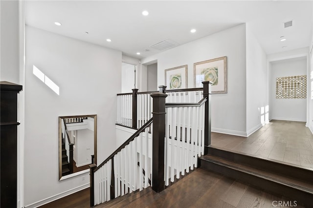 stairway with wood-type flooring