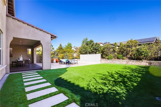 view of yard featuring an outdoor living space and a patio