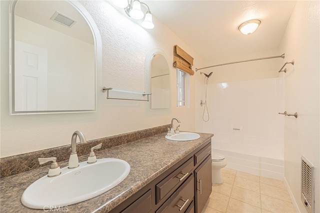 full bathroom with tile patterned floors, shower / tub combination, vanity, and toilet