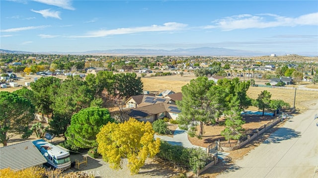 birds eye view of property with a mountain view