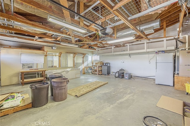 basement featuring white fridge