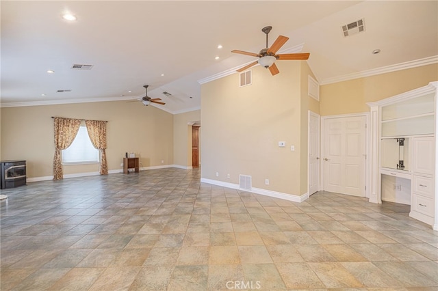 unfurnished room featuring a wood stove, ceiling fan, and crown molding