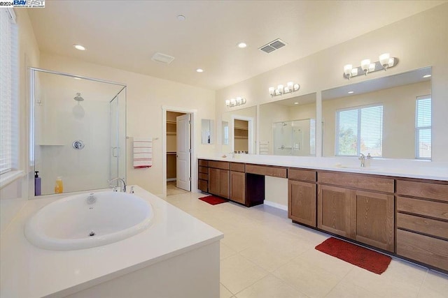 bathroom with vanity and a shower with shower door