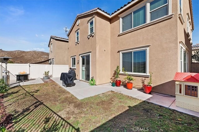 rear view of property with a patio