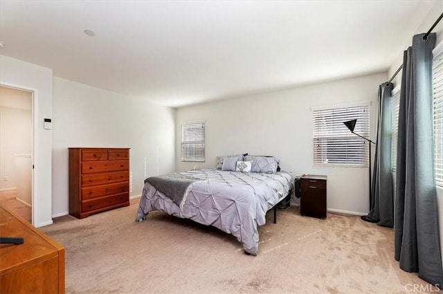 bedroom featuring light carpet