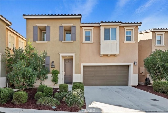 mediterranean / spanish-style home featuring a garage