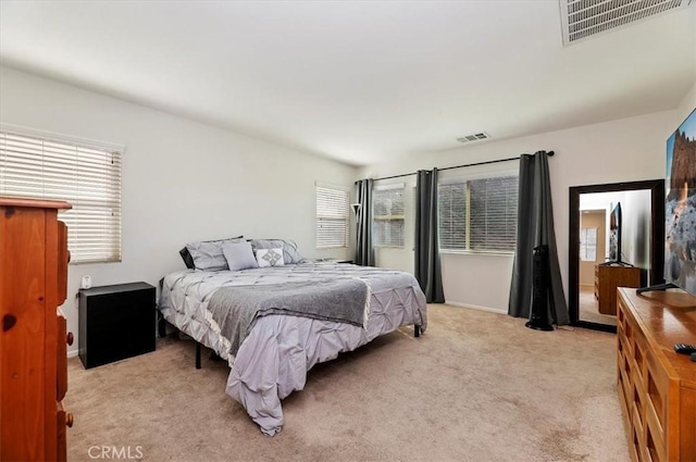 bedroom with light colored carpet