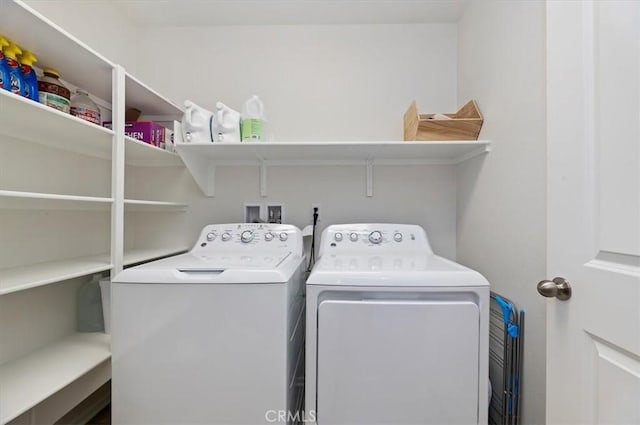 clothes washing area featuring washing machine and clothes dryer