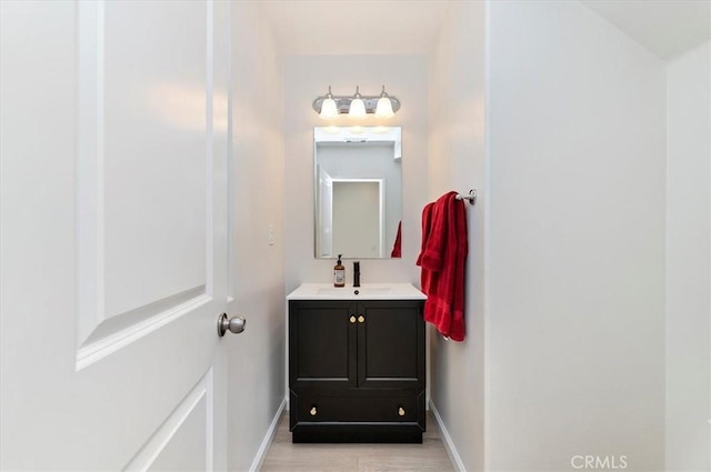 bathroom with vanity and hardwood / wood-style flooring