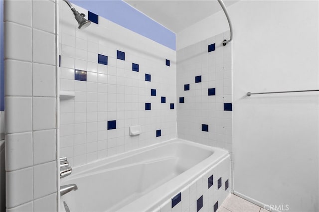 bathroom featuring tile patterned flooring and tiled shower / bath combo