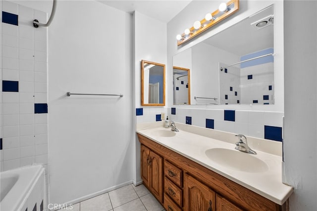 bathroom with tile patterned flooring, vanity, tiled shower / bath combo, and tasteful backsplash