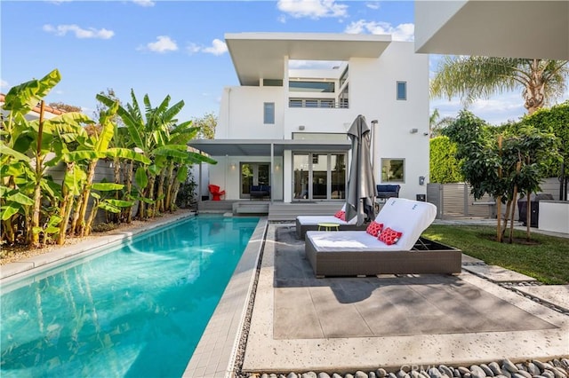 rear view of property featuring a patio area