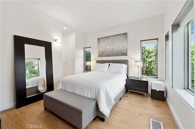 bedroom with light wood-type flooring