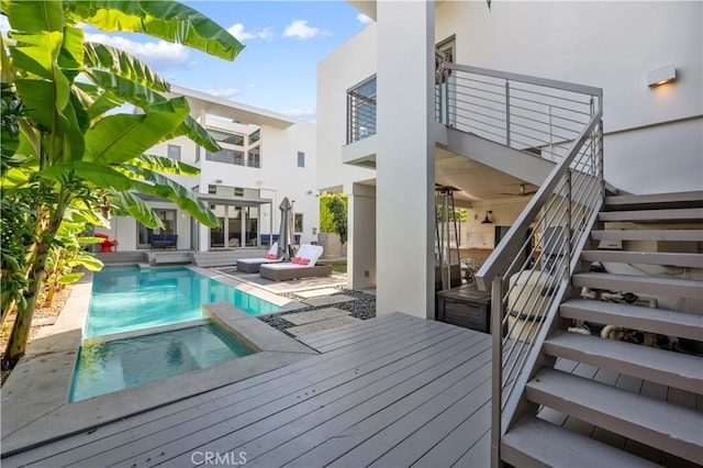 view of pool with an in ground hot tub and a patio