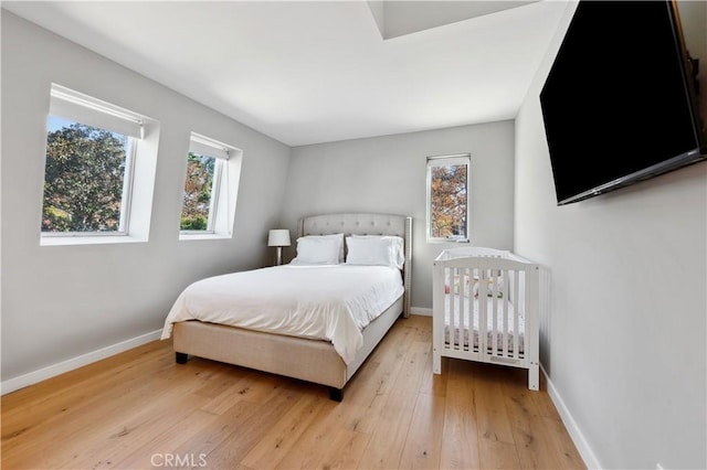 bedroom with light hardwood / wood-style flooring