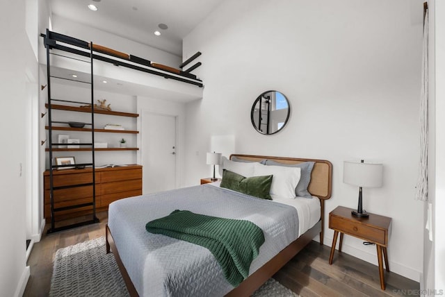 bedroom featuring dark wood-type flooring