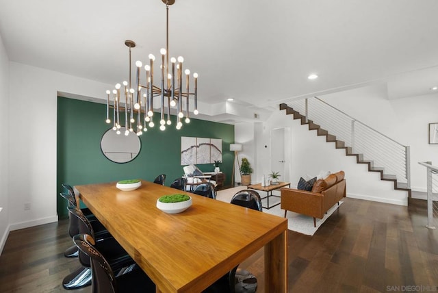 dining room featuring dark hardwood / wood-style flooring and an inviting chandelier