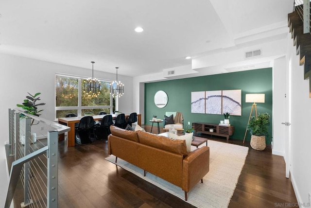 living room featuring dark hardwood / wood-style flooring and a notable chandelier