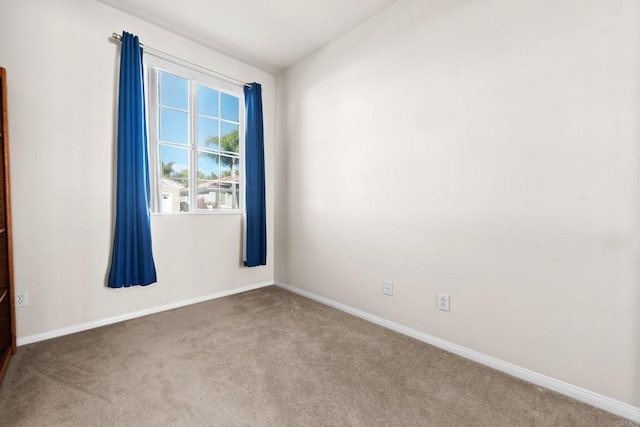 empty room with light colored carpet