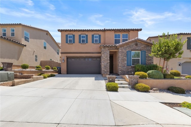 mediterranean / spanish-style home with a garage