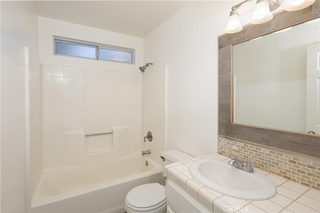 full bathroom with vanity, shower / bath combination, tasteful backsplash, and toilet