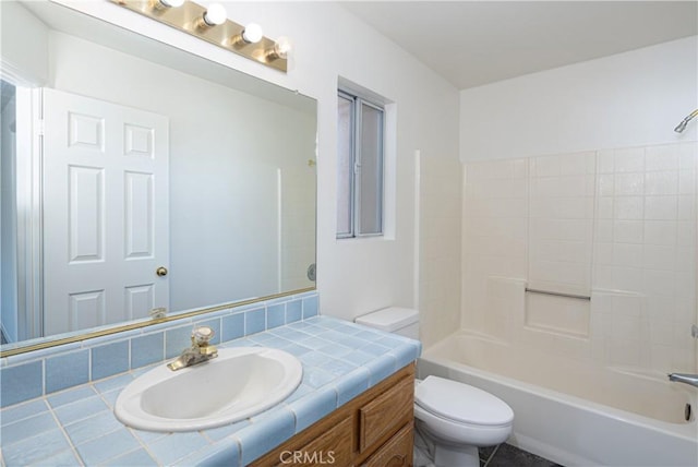 full bathroom featuring bathing tub / shower combination, vanity, and toilet