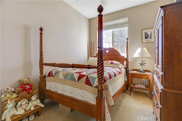 bedroom with ceiling fan and light colored carpet