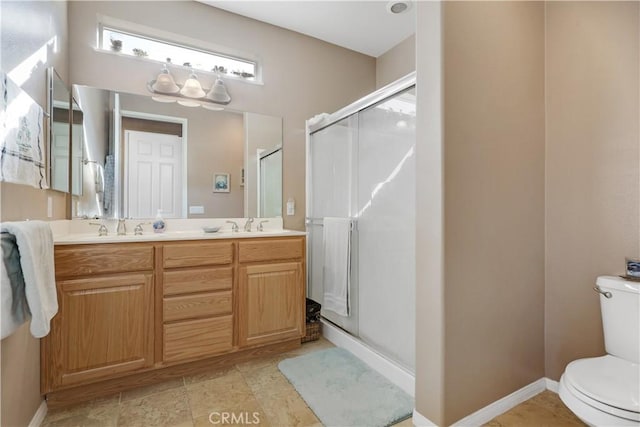 bathroom with vanity, toilet, and walk in shower