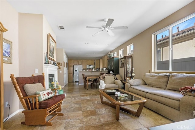 living room with ceiling fan