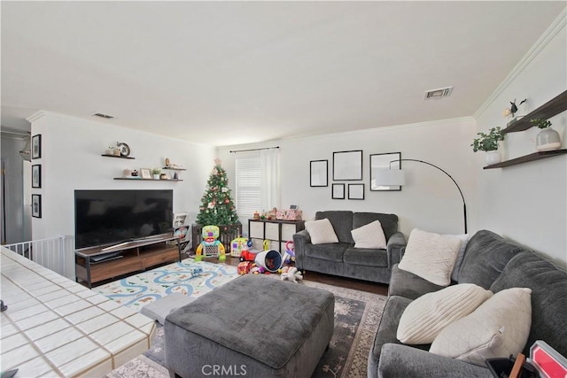 living room with wood-type flooring and crown molding