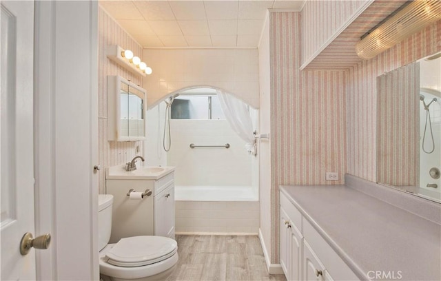 full bathroom with toilet, vanity, independent shower and bath, and hardwood / wood-style flooring